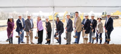Group of people at a groundbreaking ceremony.