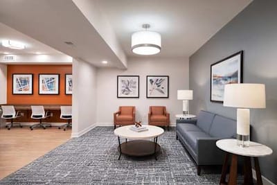 Comfortable common area with seating and artwork.