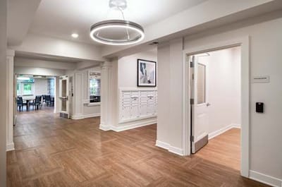 Interior hallway with mailboxes and seating area
