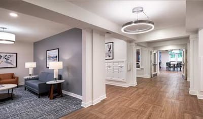 Bright common area with seating and artwork.
