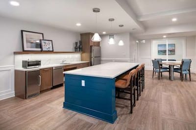 Bright common kitchen area with seating