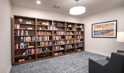 Cozy reading area with bookshelves and seating.