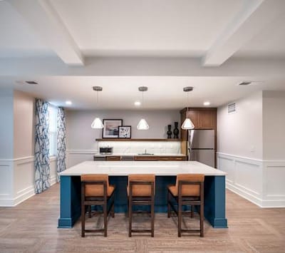 Modern kitchen with bar stools and pendant lighting