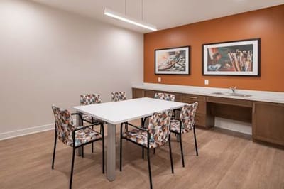 Bright common area with modern furniture and decor.