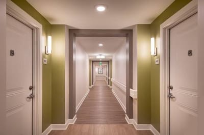 Interior hallway with doors and lighting