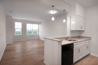 Clean, modern apartment interior with kitchen.