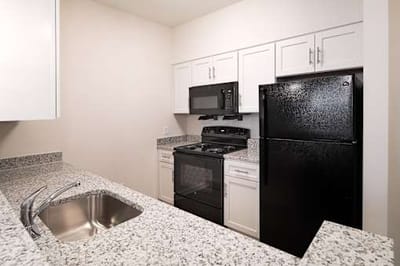 Compact kitchen area with appliances