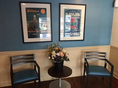 Lobby area with seating and decorative artwork.