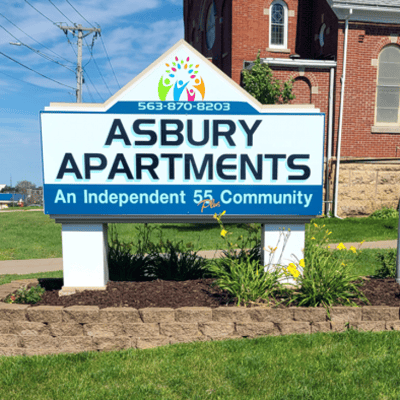 Sign for Asbury Senior Apartments outside the facility