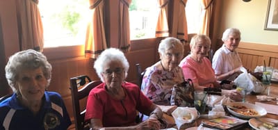 Residents enjoying a meal together at the dining area