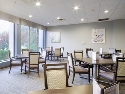 Bright common area with tables and chairs