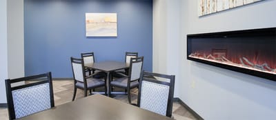 Interior view of a cozy dining area with tables and chairs