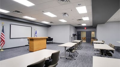 Interior view of a community activity room with a wooden podium