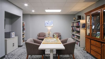 Cozy common area with bookshelves and seating