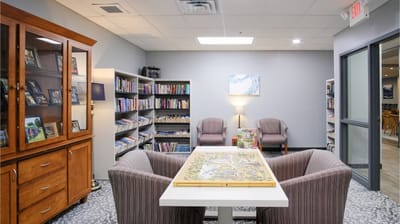 Cozy common area with seating and bookshelves