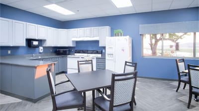 Bright kitchen area with modern appliances and seating