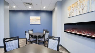 Common area with tables and cozy decor