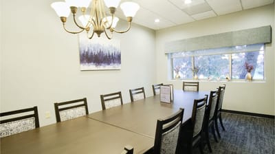 Bright dining area with a long table and chairs