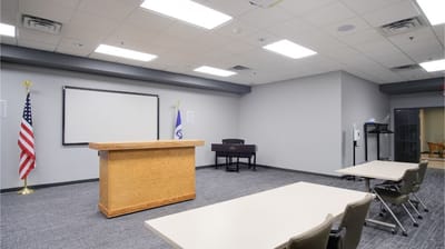 A conference room with a podium and seating