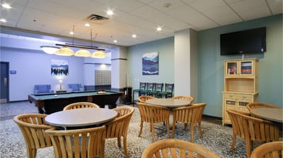 Interior common area with tables and pool table