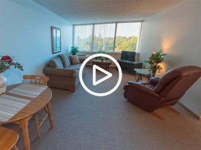 Cozy resident room with a couch and dining table