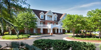 Exterior view of Willows Senior Community surrounded by greenery