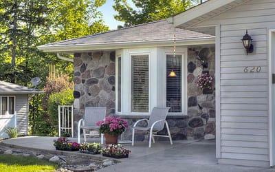 Exterior view of a residence with a patio and flowers