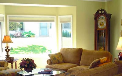 Cozy common area with a couch and large windows