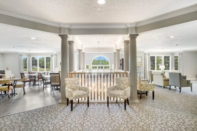 Interior view of a common area with seating and natural light