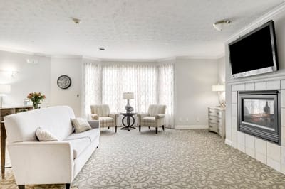 Cozy common area with comfortable seating and a fireplace