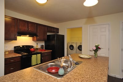 Bright kitchen area with appliances and decor