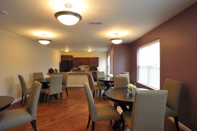 Dining area with tables and chairs in a well-lit room