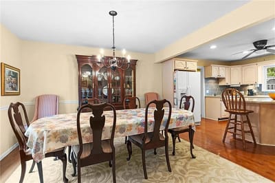 Bright dining room with a large table and chairs