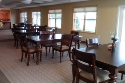 Quiet dining area with wooden tables and chairs