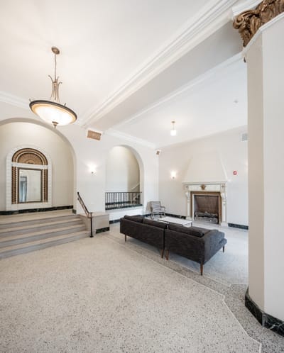 Interior view of a spacious lobby area with seating