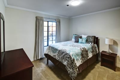 Cozy private resident room with a bed and window