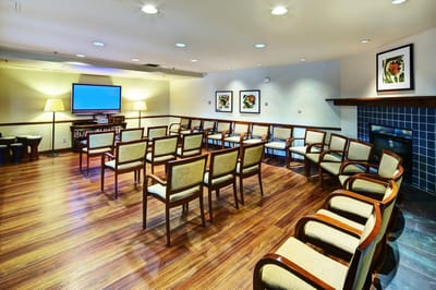 Bright common area with seating and artwork