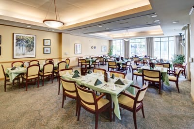 Dining room setup with tables and chairs