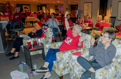 Residents enjoying a lively activity in the common area