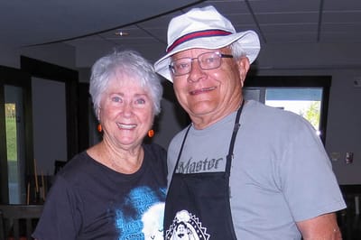 Two residents smiling together in a common area