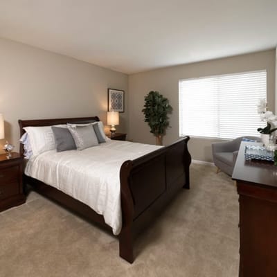 Well-furnished private bedroom in a senior living facility