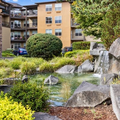 Beautiful courtyard with a pond and waterfall in an apartment complex