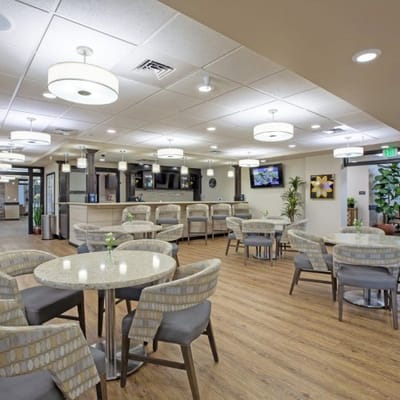 Bright dining area with tables and chairs
