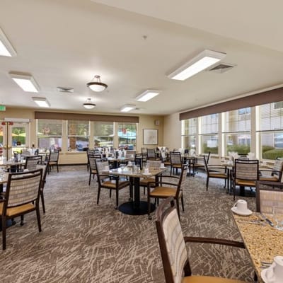Dining area with tables set for residents