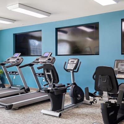 Well-equipped fitness room with exercise machines