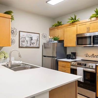 Modern kitchen with stainless steel appliances and decor