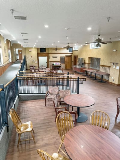 Interior view of a common area with tables and chairs