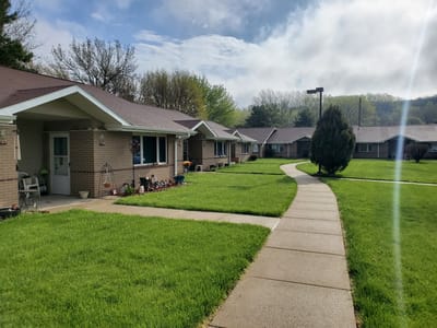 Pathway leading through the senior apartments with well-kept lawns