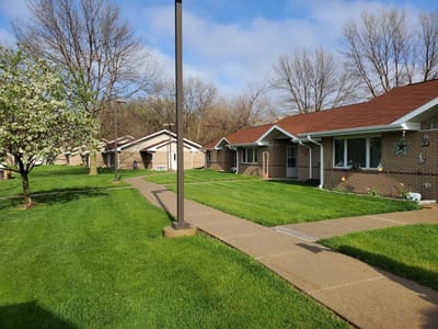 View of well-maintained outdoor space with apartments