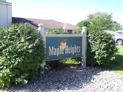 Sign for Maple Heights facility surrounded by greenery